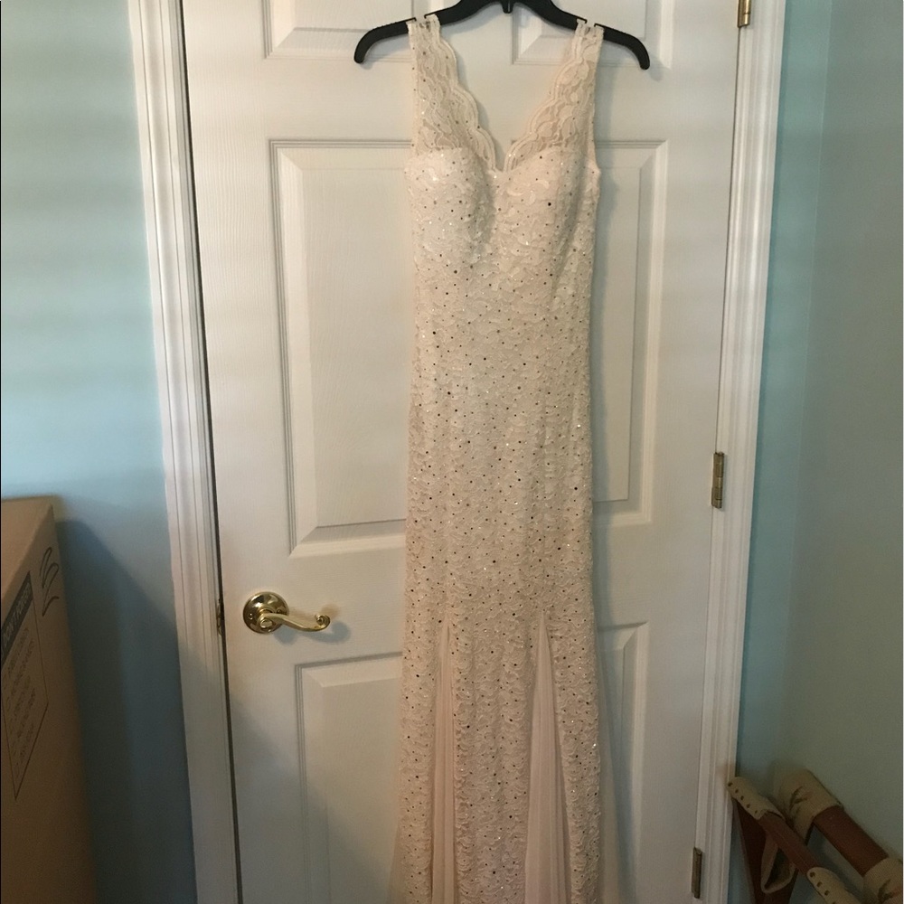 Beige gown with sequin and lace detail.